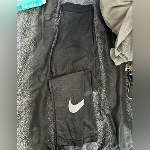 Black metallic Nike leggings in large. Great condition. No pilling or fading